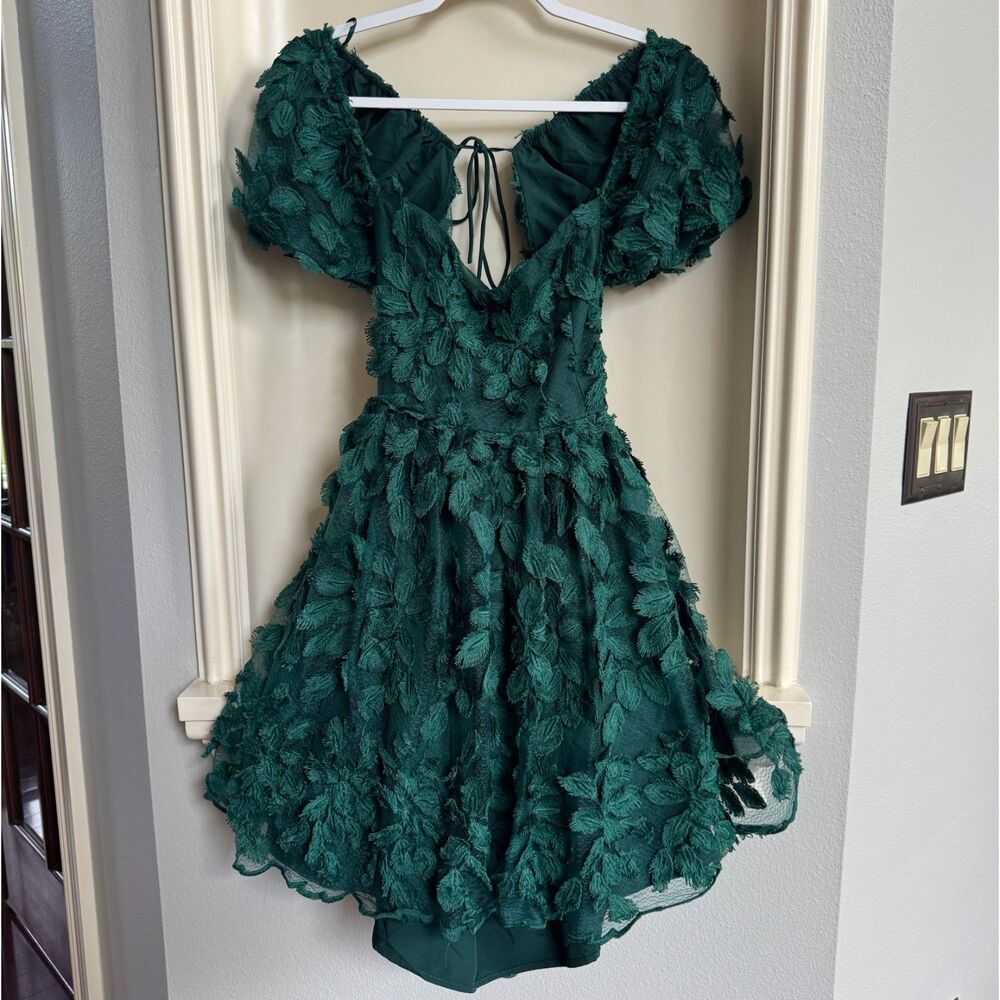 Love Triangle mini baby doll dress with backless ties in emerald leafy 3D lace